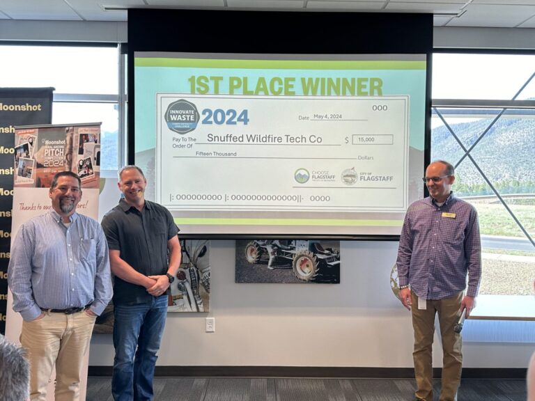 Craig Znetko, Flagstaff Fire Captain Mike Felts and Jeff Saville in front of the Innovate Waste 1st Place check.