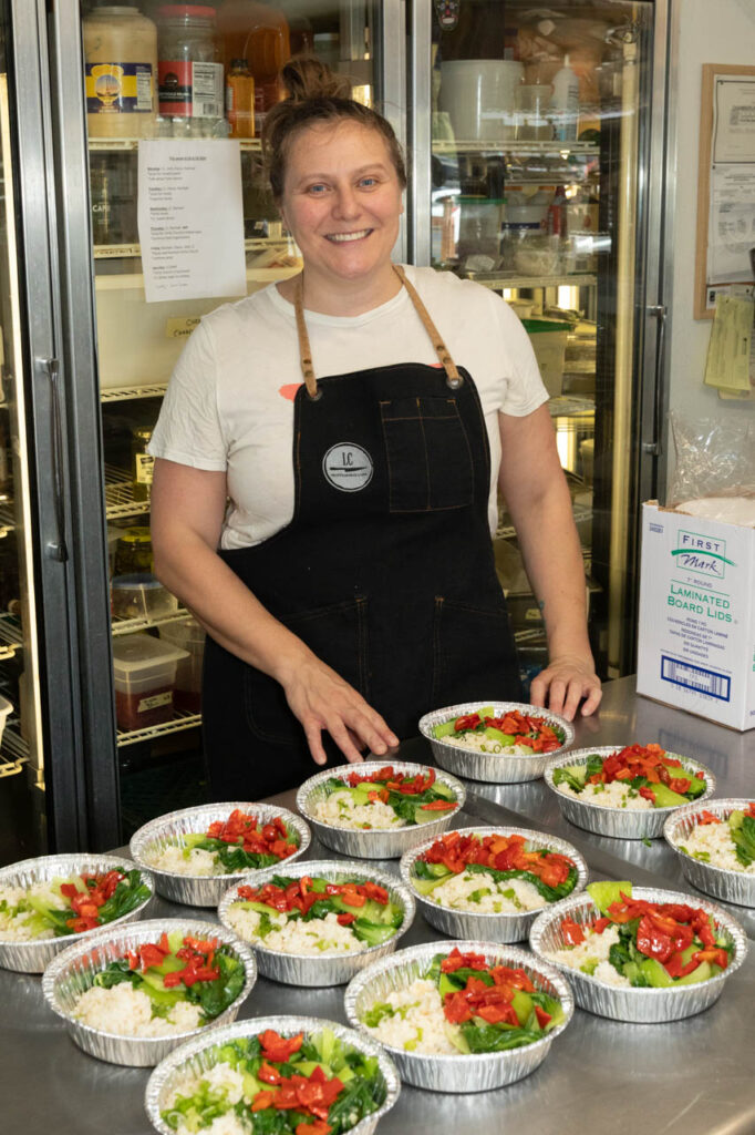 Laura's assistant prepping eat-at-home meals.