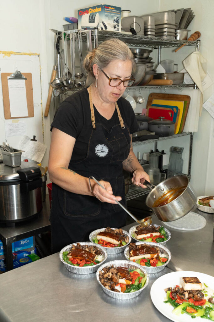 Laura Chamberlin adds sauce to eat-at-home meals. 